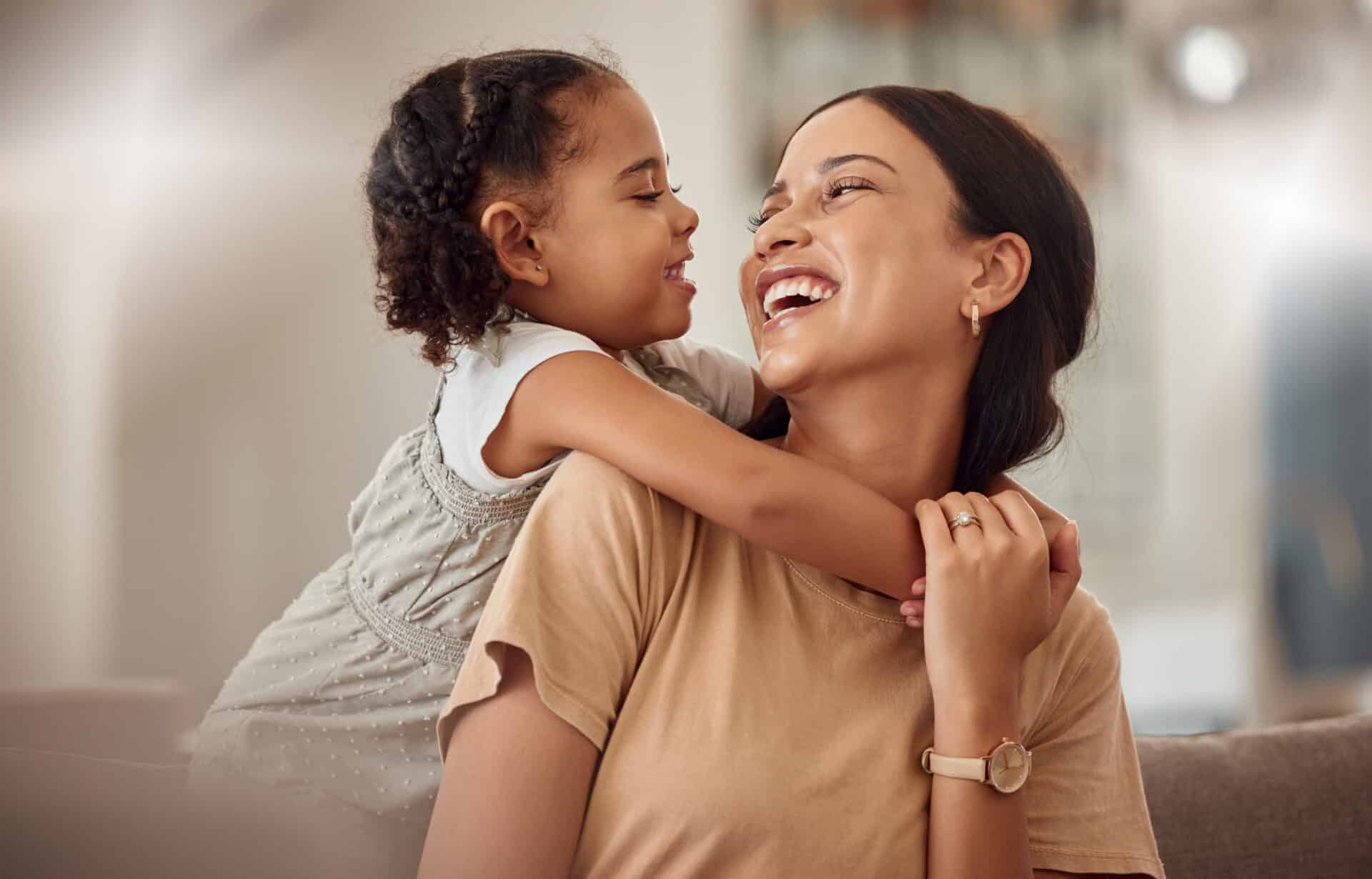 Young child with mother smiling